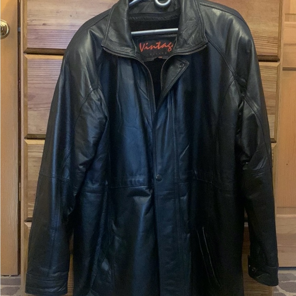 Vintage brand-black genuine leather 3/4 coat w/zip out plush lining.